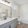 a bathroom with a large mirror and garden sized tub